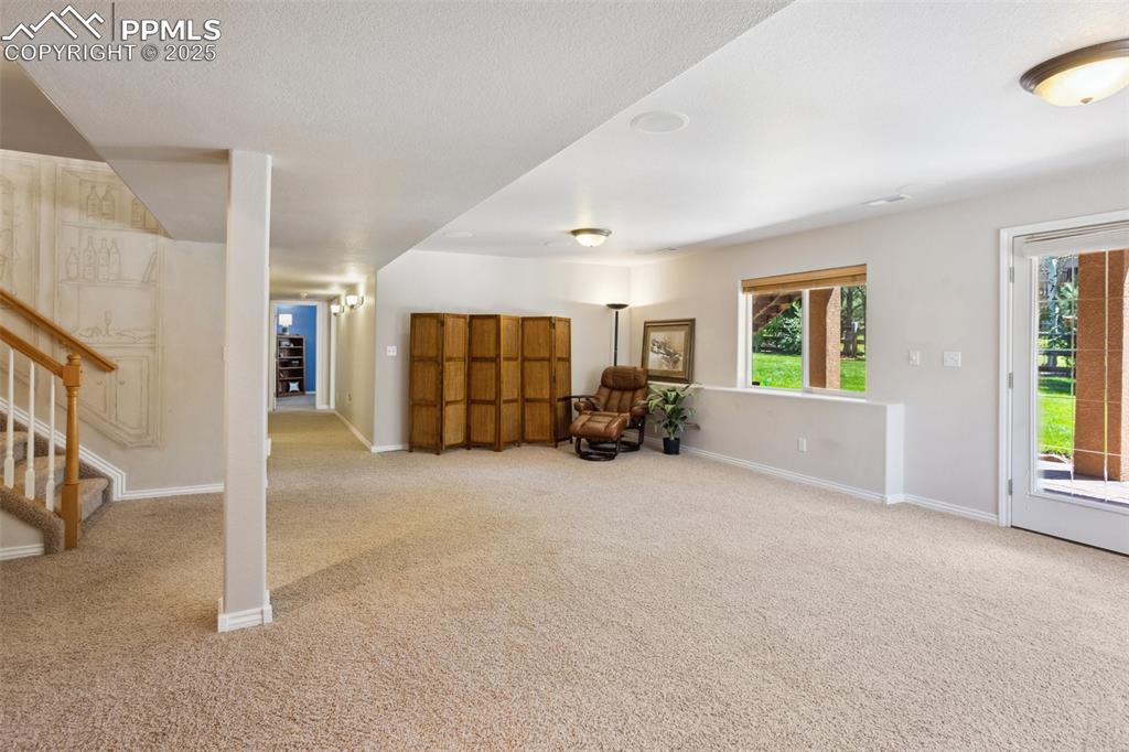 16243 Kitchener Way Monument, CO 80132 - Photo 18 of 33 an empty room with furniture and windows