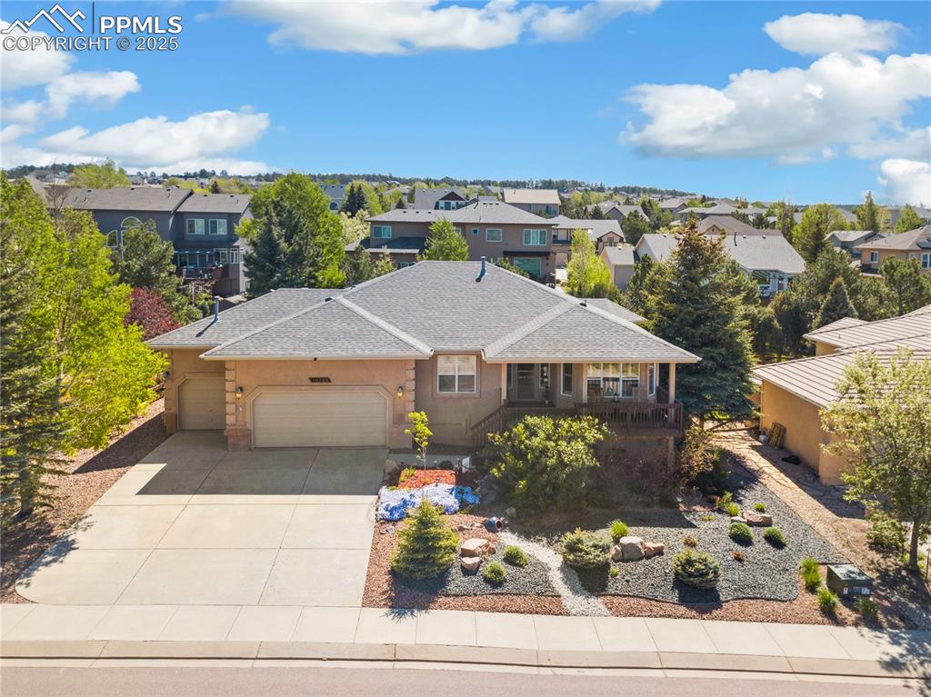 16243 Kitchener Way Monument, CO 80132 - Photo 25 of 33 view of a terrace with a garden