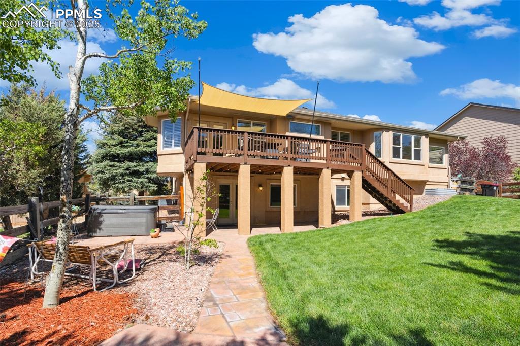 16243 Kitchener Way Monument, CO 80132 - Photo 27 of 33 a view of a house with a yard