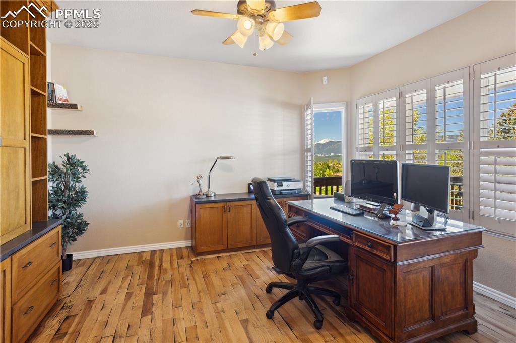 16243 Kitchener Way Monument, CO 80132 - Photo 9 of 33 a view of a workspace with furniture and a window