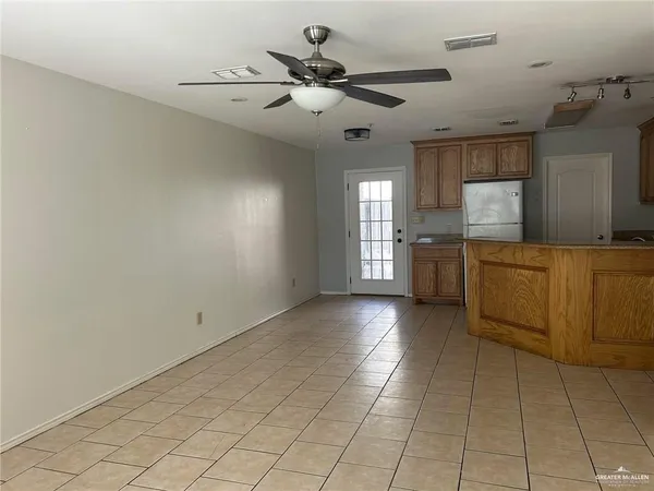 a view of a kitchen with a sink and a window