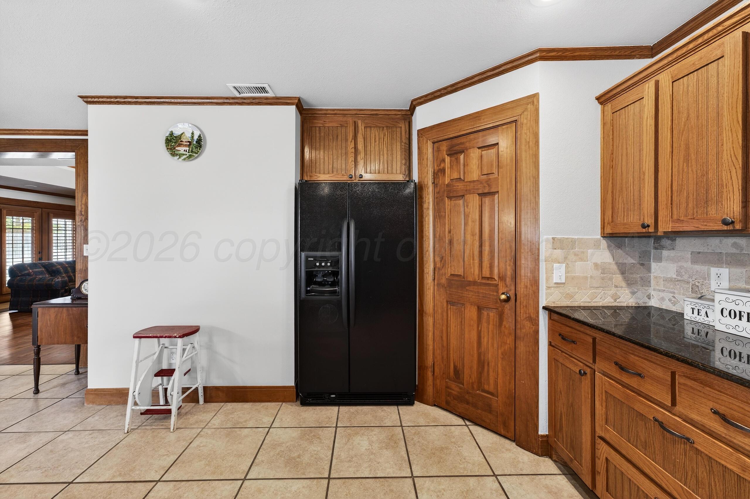 312 Dysart Street Claude, TX 79019 - Photo 13 of 37 a view of a kitchen with refrigerator and cabinet