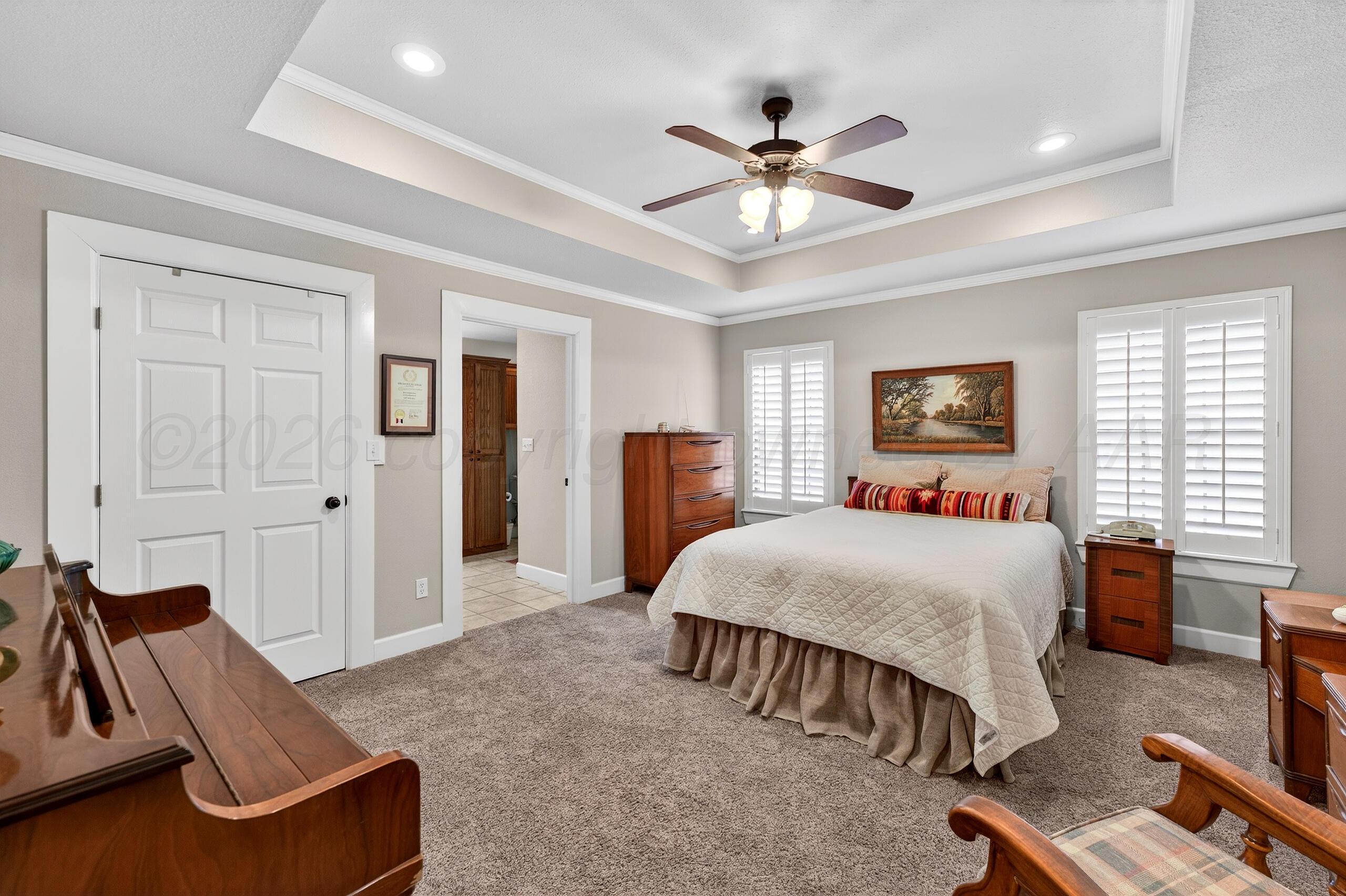 312 Dysart Street Claude, TX 79019 - Photo 18 of 37 a bedroom with a bed and furniture
