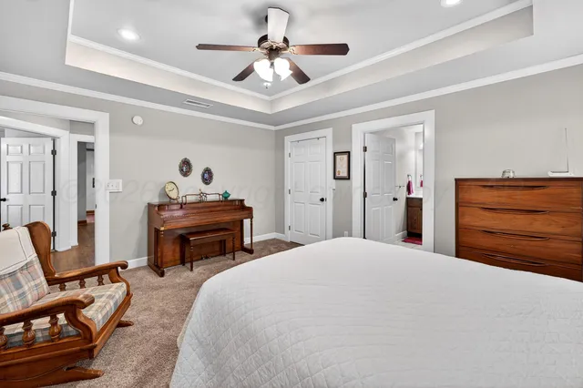 a bedroom with a bed and a chair