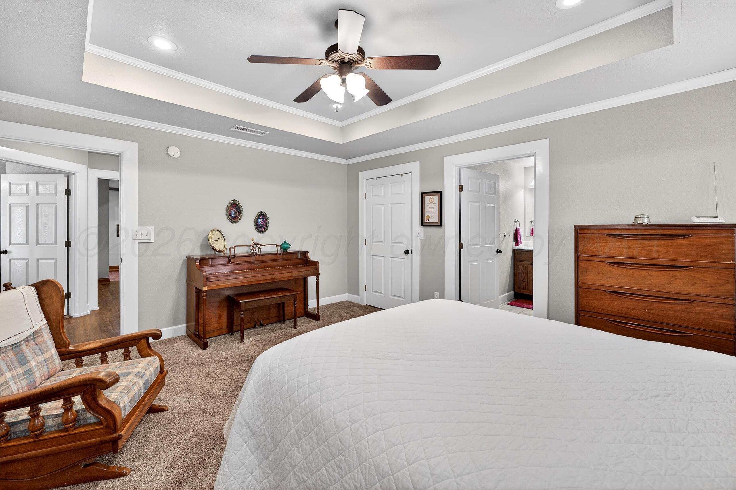 312 Dysart Street Claude, TX 79019 - Photo 20 of 37 a bedroom with a bed and a chair
