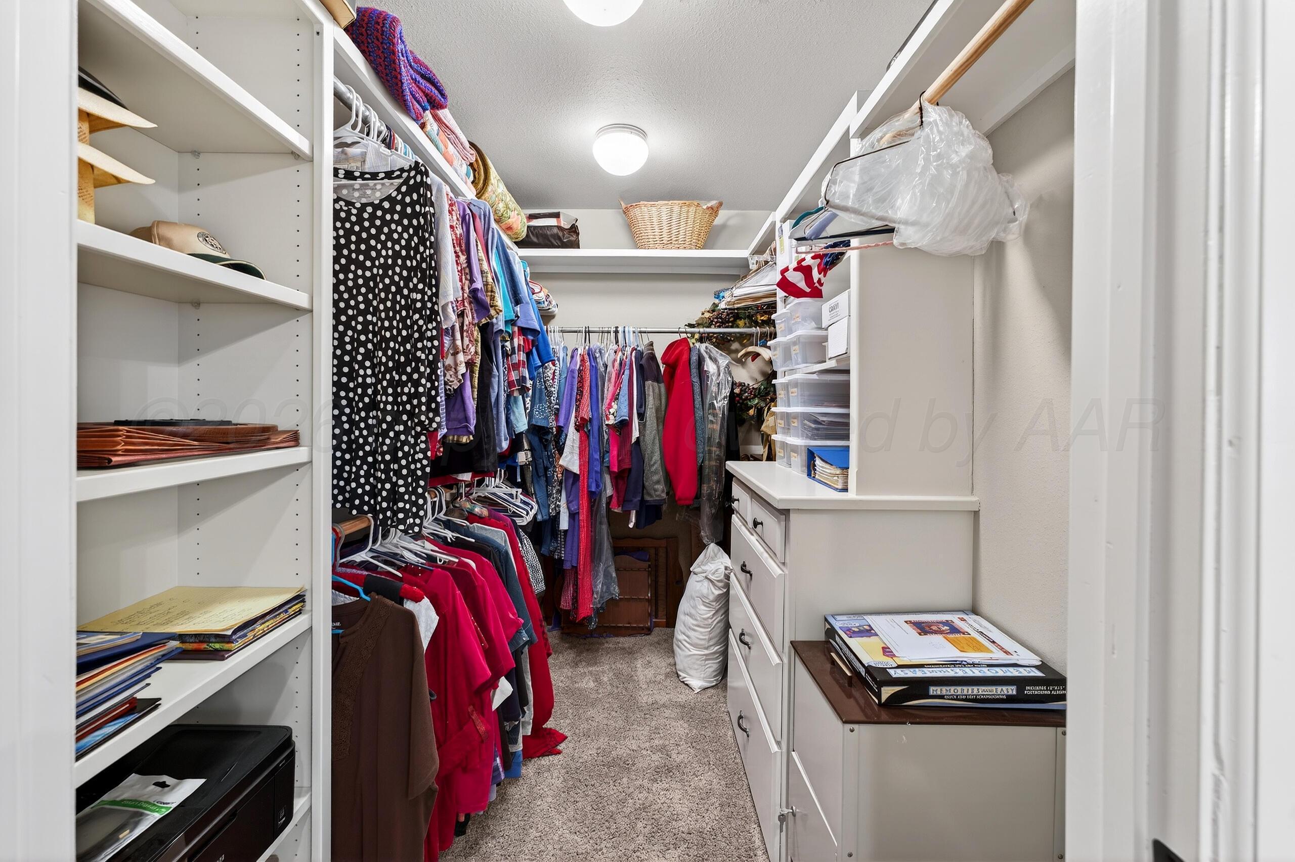 312 Dysart Street Claude, TX 79019 - Photo 24 of 37 a view of walk in closet with clothes
