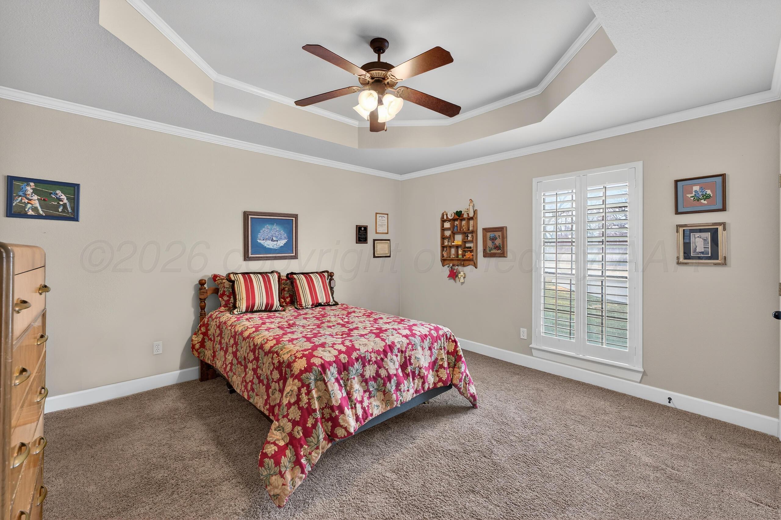 312 Dysart Street Claude, TX 79019 - Photo 30 of 37 a bedroom with a large bed and a window