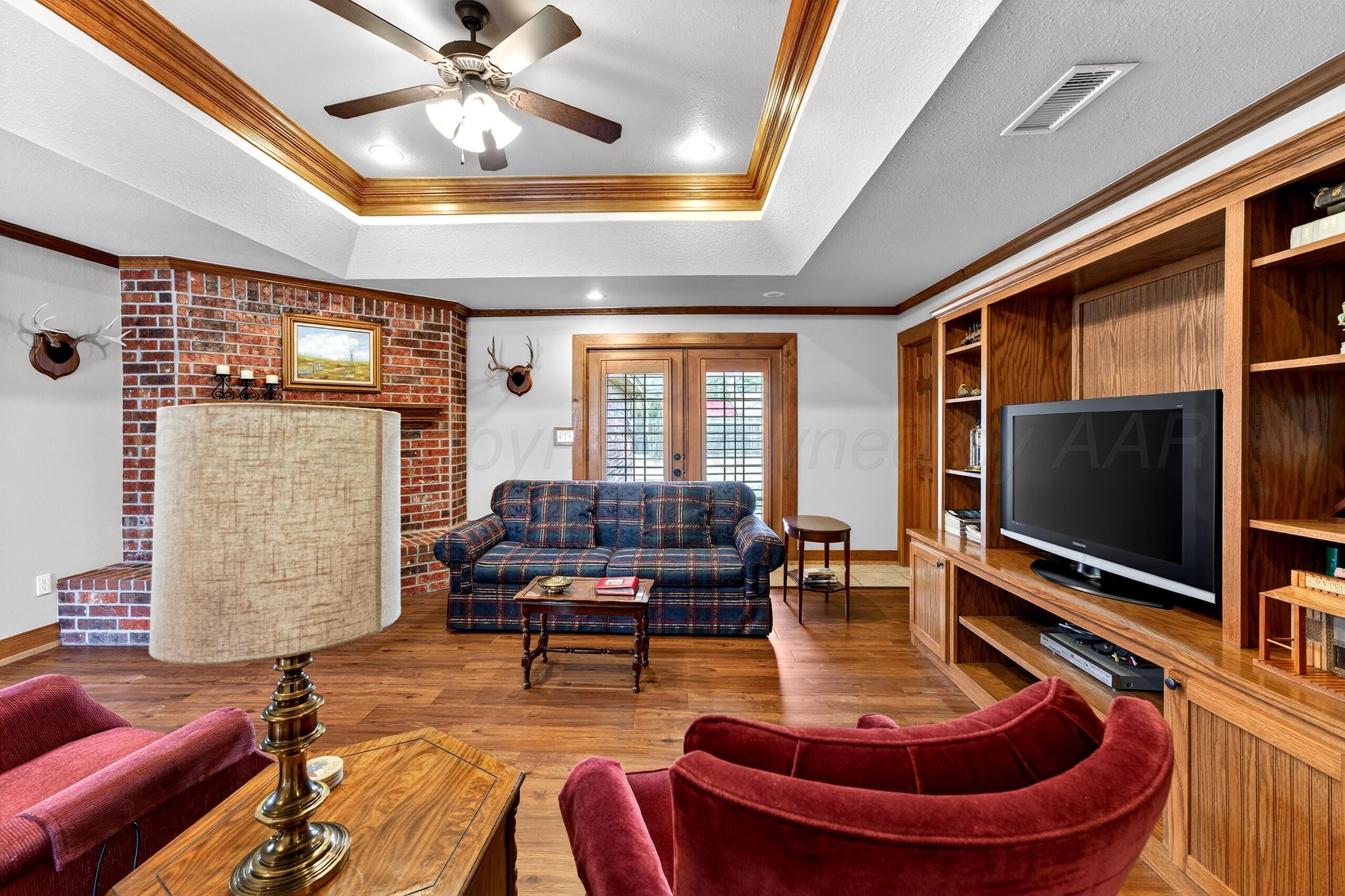 312 Dysart Street Claude, TX 79019 - Photo 6 of 37 a living room with patio furniture and a flat screen tv