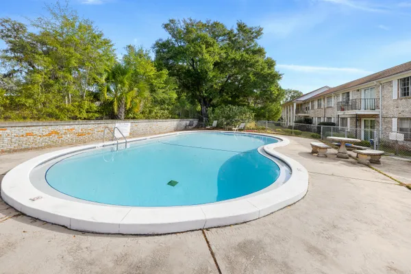 a view of a swimming pool with a patio
