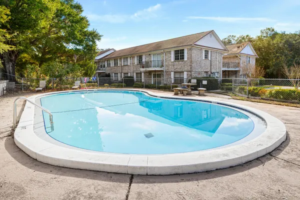 a view of a house with swimming pool and porch
