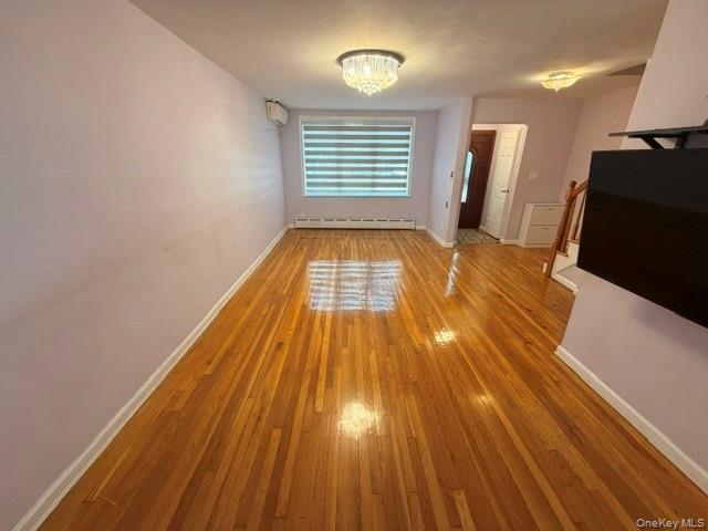 150-06 78th Road Queens, NY 11367 - Photo 4 of 22 a view of empty room with wooden floor