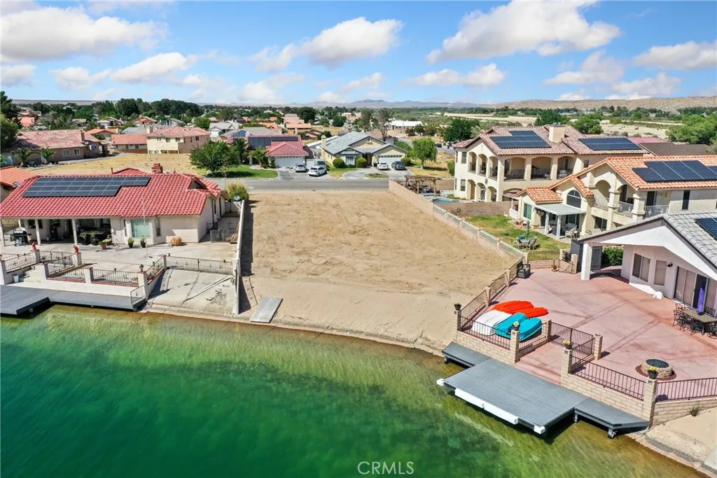 0 Bluewater Road Helendale, CA 92342 - Photo 1 of 9 an aerial view of a house with a garden and lake view