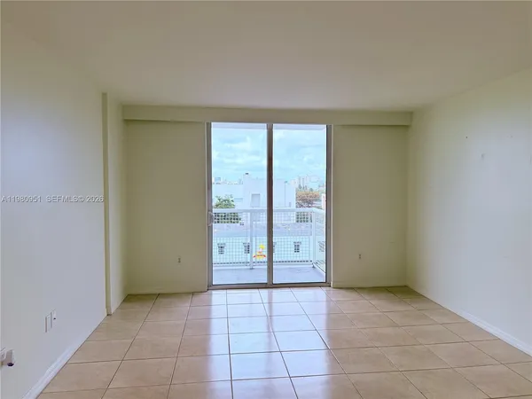 a kitchen with a refrigerator and a sink