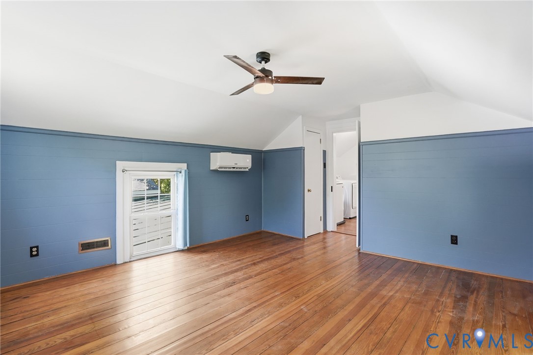 2297 Indian Oak Road Crewe, VA 23930 - Photo 26 of 53 an empty room with wooden floor cabinet and windows