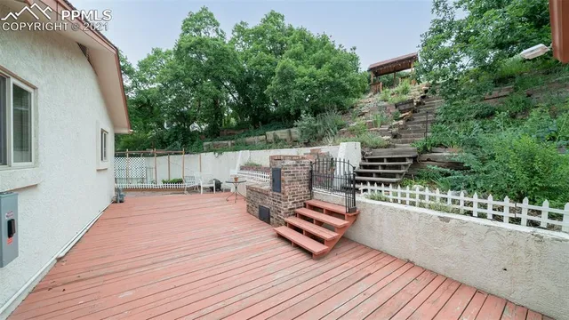 a wooden bench sitting on top of a wooden floor