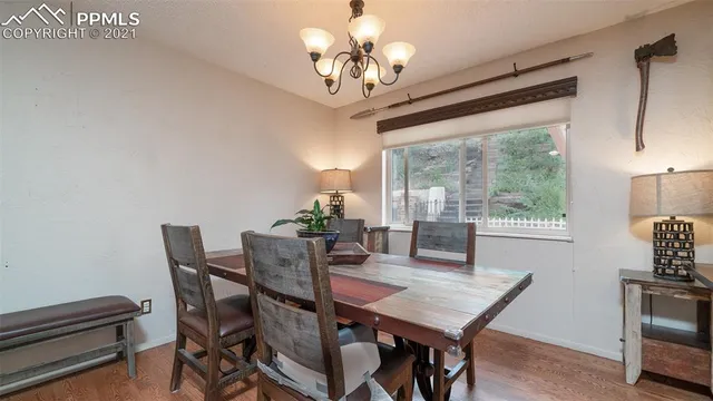 a living room with furniture a flat screen tv and a large window