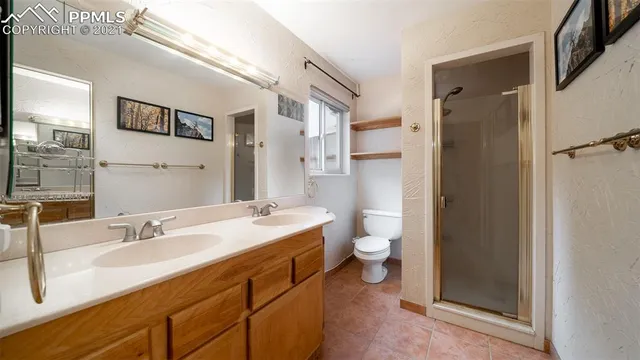 a bed room with a bed and a ceiling fan