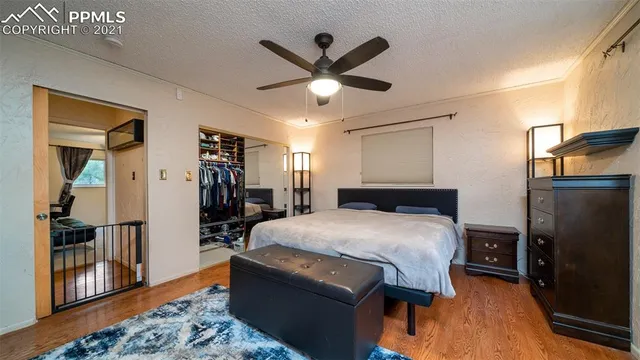 a bedroom with furniture and a lamp