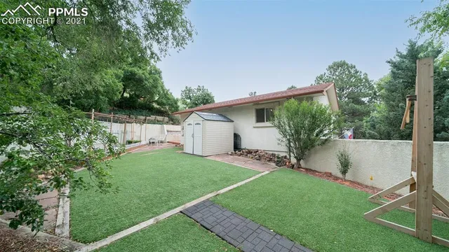 an aerial view of a house with outdoor space