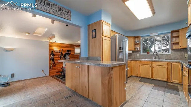 a kitchen with stainless steel appliances granite countertop a sink and cabinets