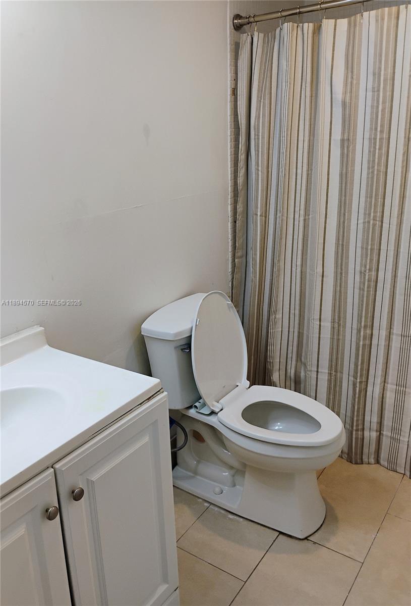 2029 Northwest 46th Avenue, Unit E107 Lauderhill, FL 33313 - Photo 12 of 12 a bathroom with a toilet and a sink