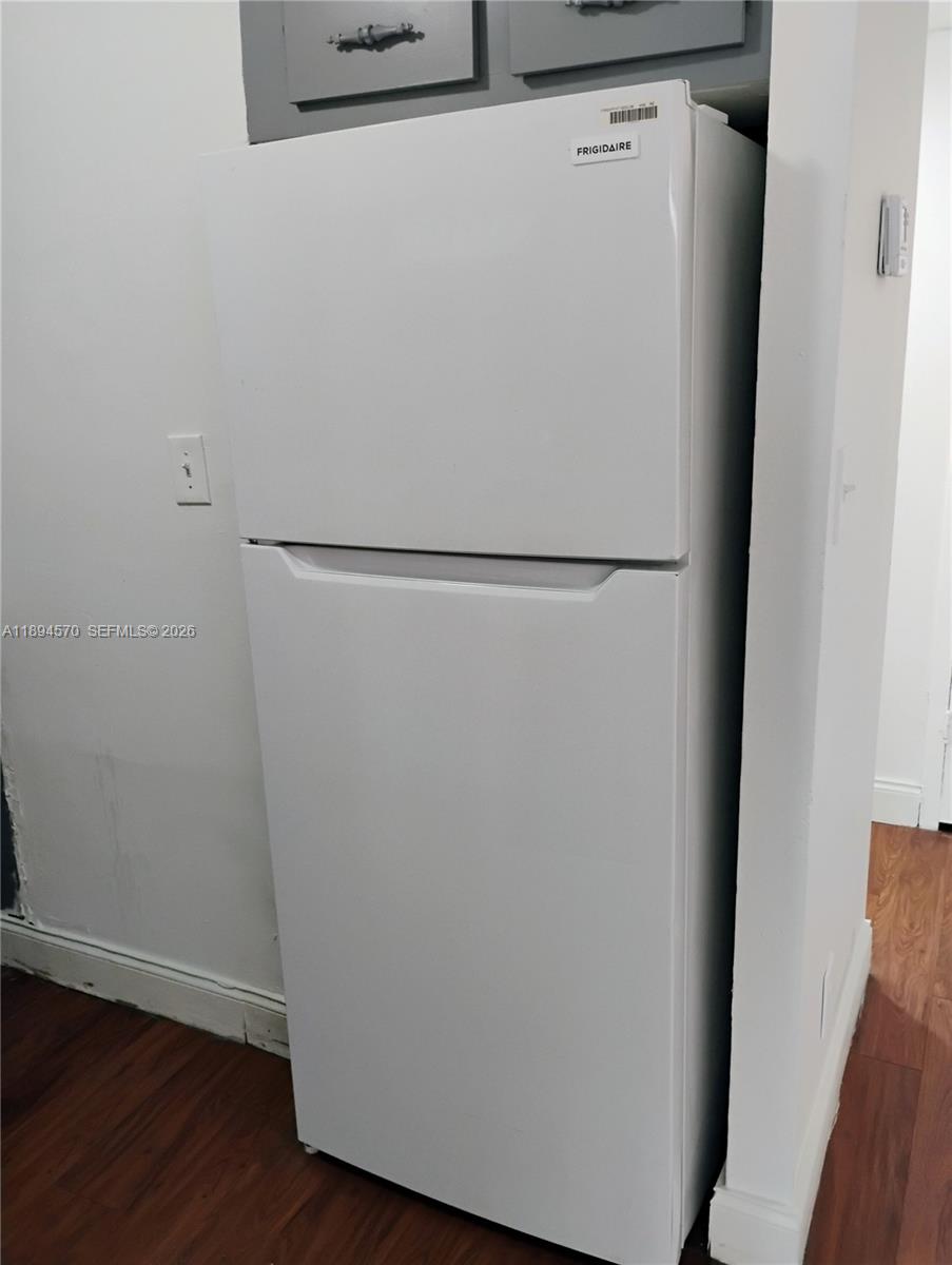 2029 Northwest 46th Avenue, Unit E107 Lauderhill, FL 33313 - Photo 3 of 12 a close view of a closet with wooden floor