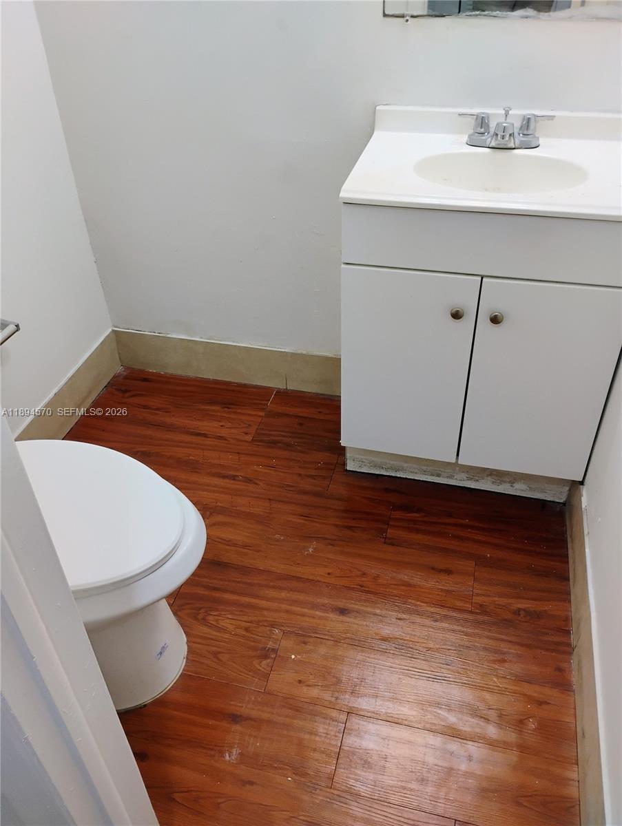 2029 Northwest 46th Avenue, Unit E107 Lauderhill, FL 33313 - Photo 6 of 12 a bathroom with a sink and a toilet