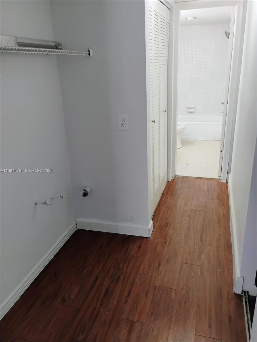 2029 Northwest 46th Avenue, Unit E107 Lauderhill, FL 33313 - Photo 10 of 12 a view of a room with wooden floor