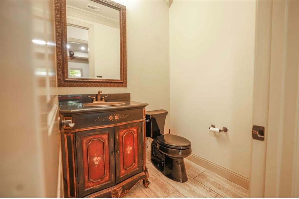1387 Shadow Lakes Drive Wills Point, TX 75169 - Photo 24 of 33 a bathroom with a sink and a toilet