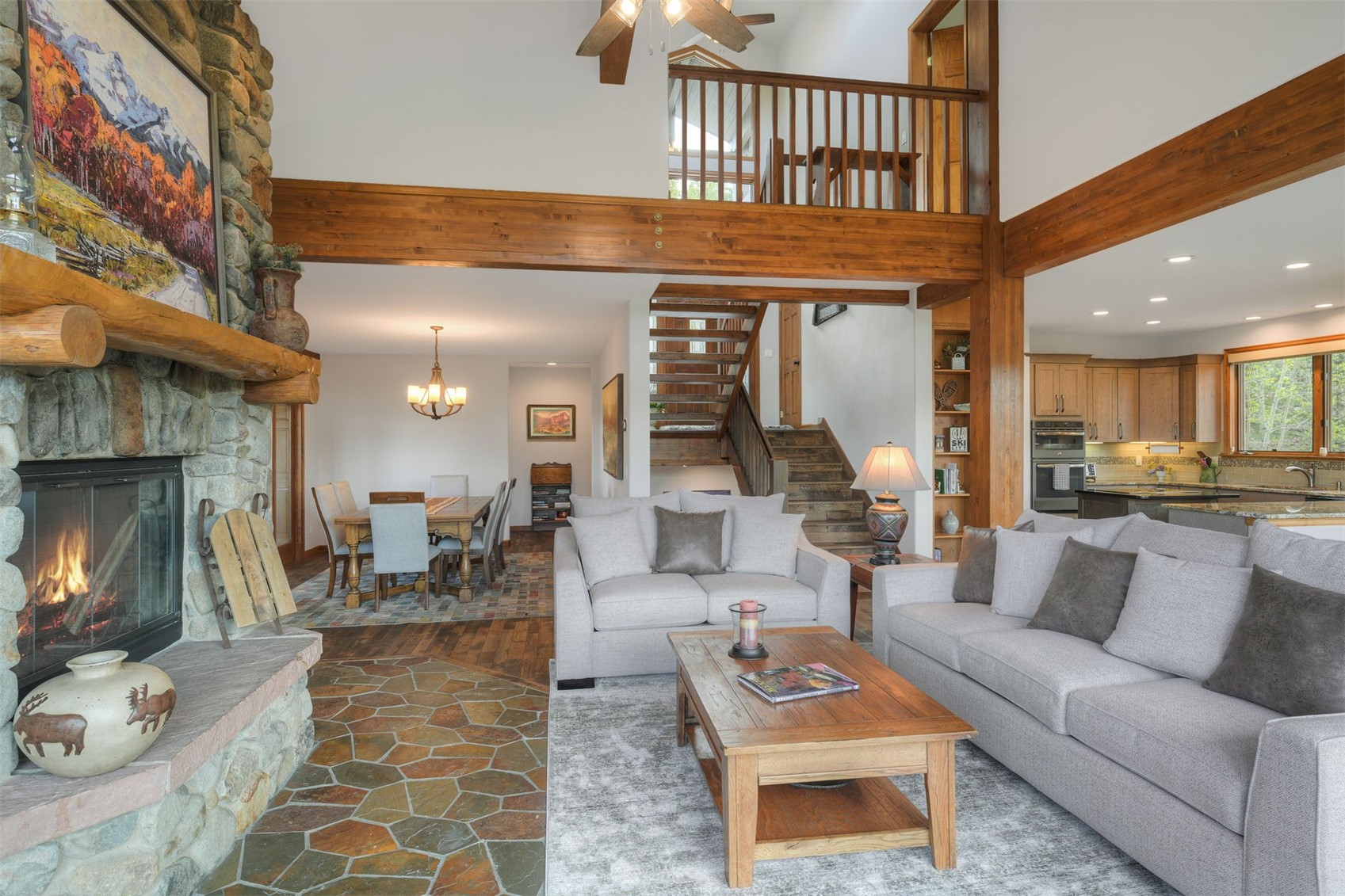 2542 Boreas Pass Road Breckenridge, CO 80424 - Photo 7 of 33 a living room with furniture and a fireplace