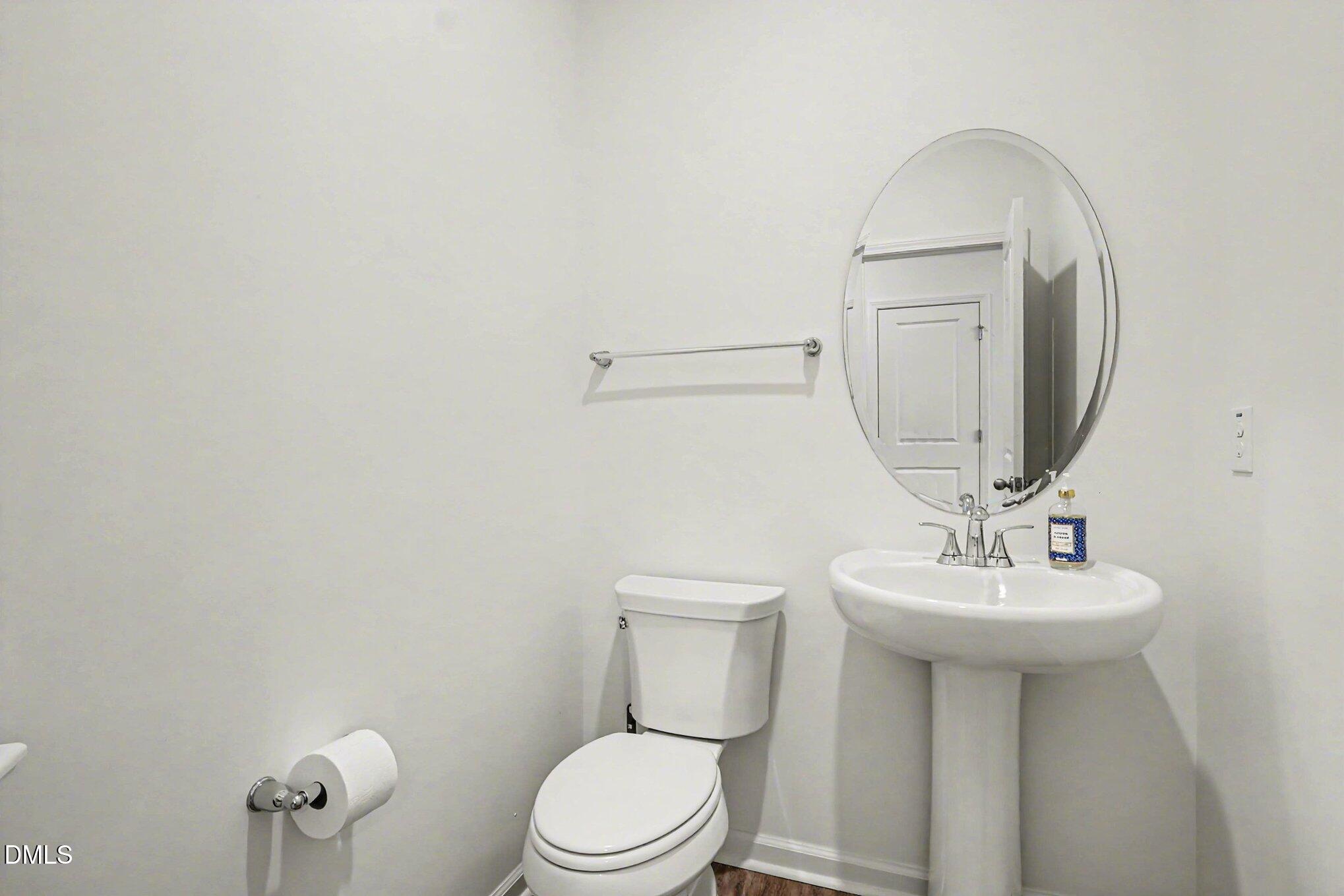 2732 Princess Tree Drive Raleigh, NC 27616 - Photo 9 of 32 a bathroom with a sink a toilet and mirror