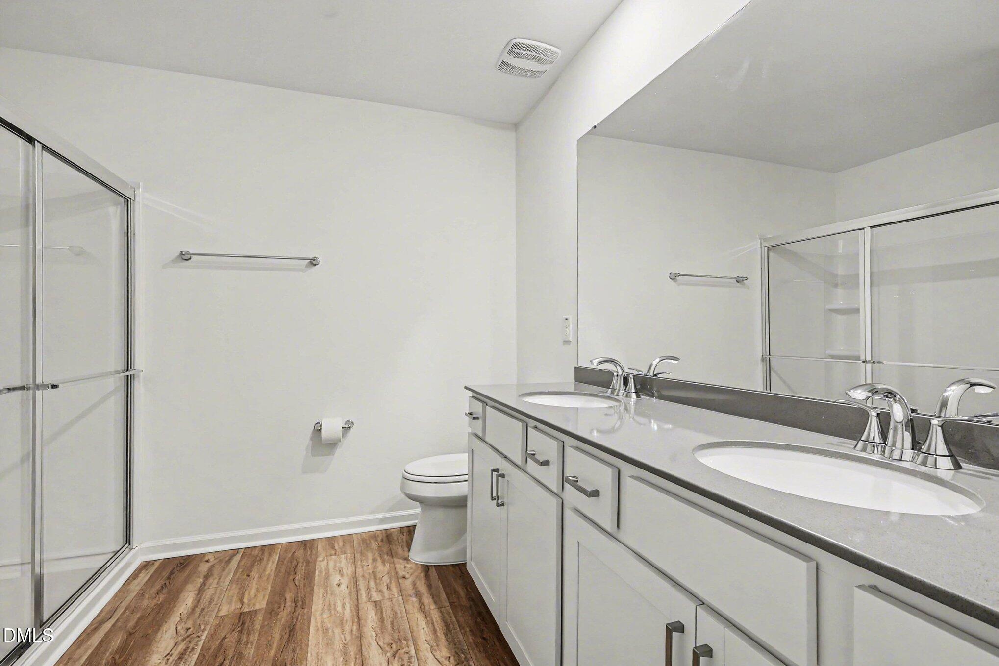 2732 Princess Tree Drive Raleigh, NC 27616 - Photo 15 of 32 a bathroom with a granite countertop sink toilet and shower curtains