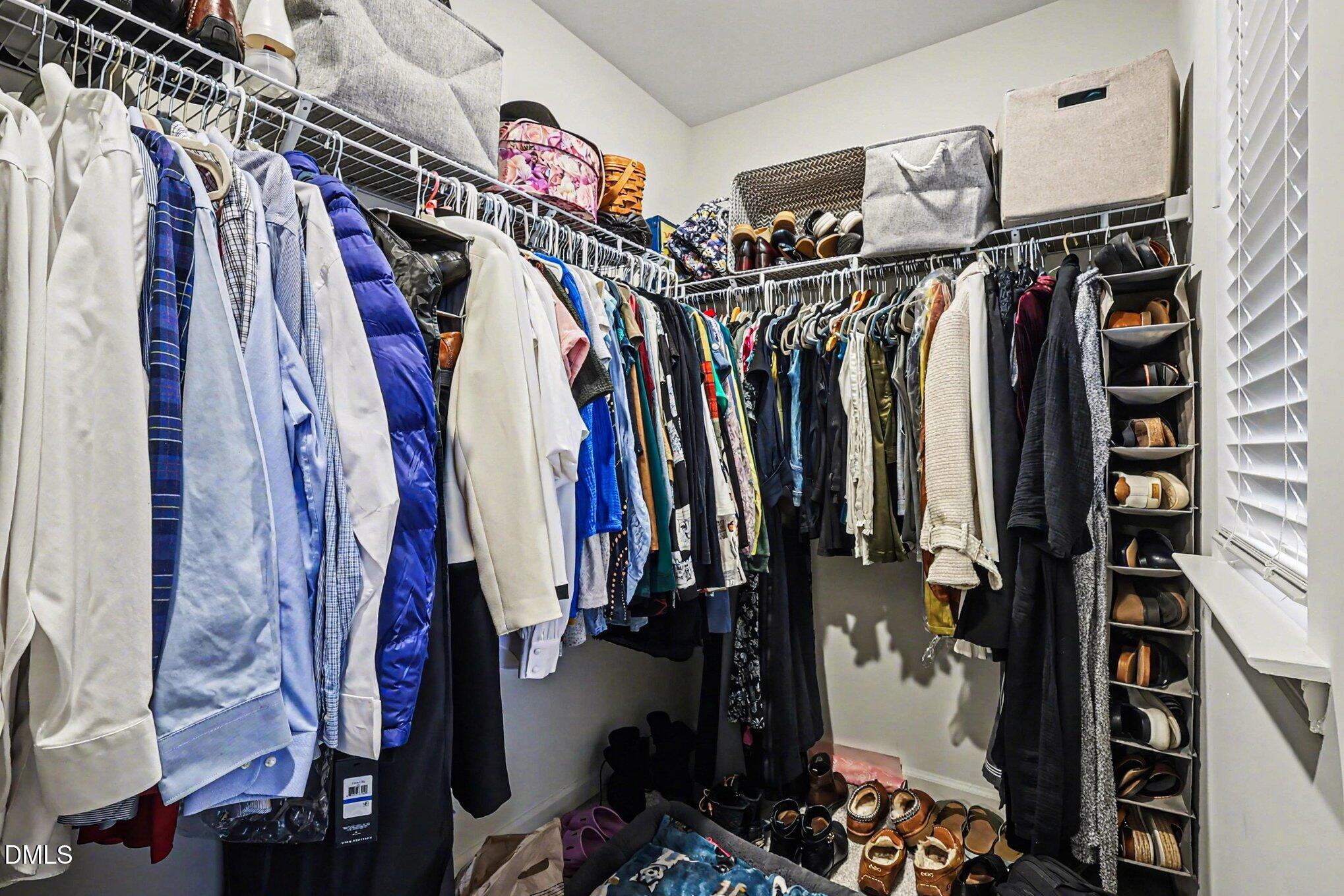 2732 Princess Tree Drive Raleigh, NC 27616 - Photo 16 of 32 a view of walk in closet with clothes