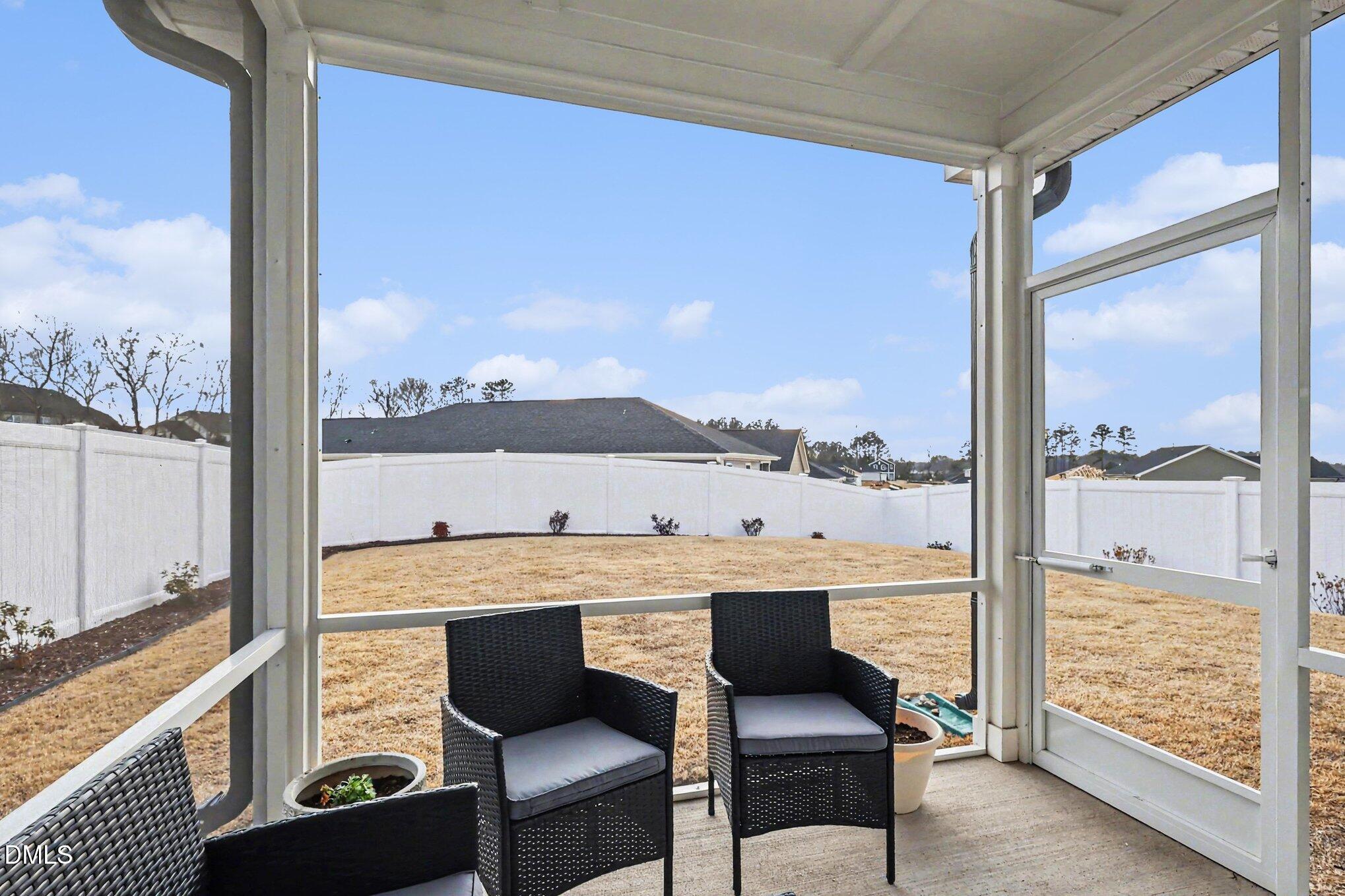 2732 Princess Tree Drive Raleigh, NC 27616 - Photo 23 of 32 a view of a living room and floor to ceiling window or kitchen