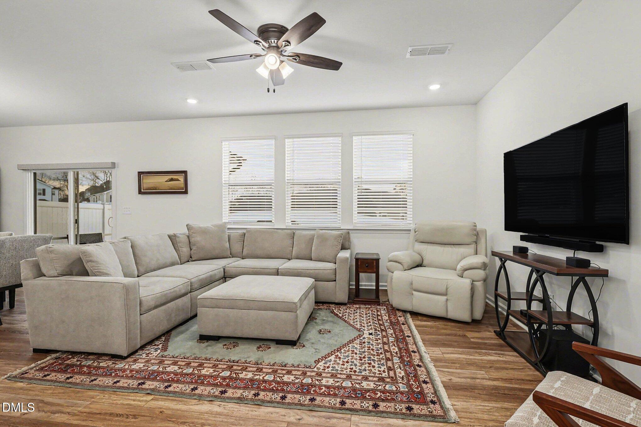 2732 Princess Tree Drive Raleigh, NC 27616 - Photo 2 of 32 a living room with furniture and a flat screen tv