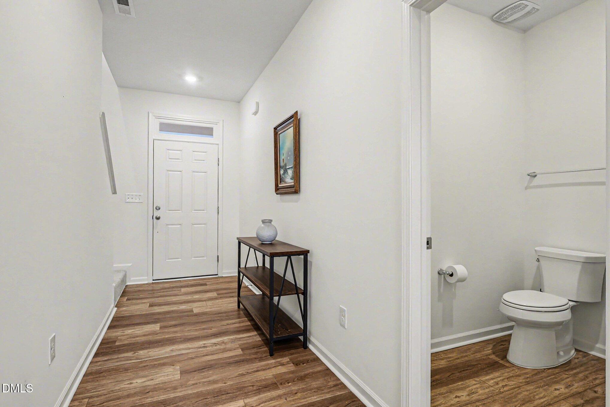 2732 Princess Tree Drive Raleigh, NC 27616 - Photo 29 of 32 a bathroom with a toilet and a hardwood
