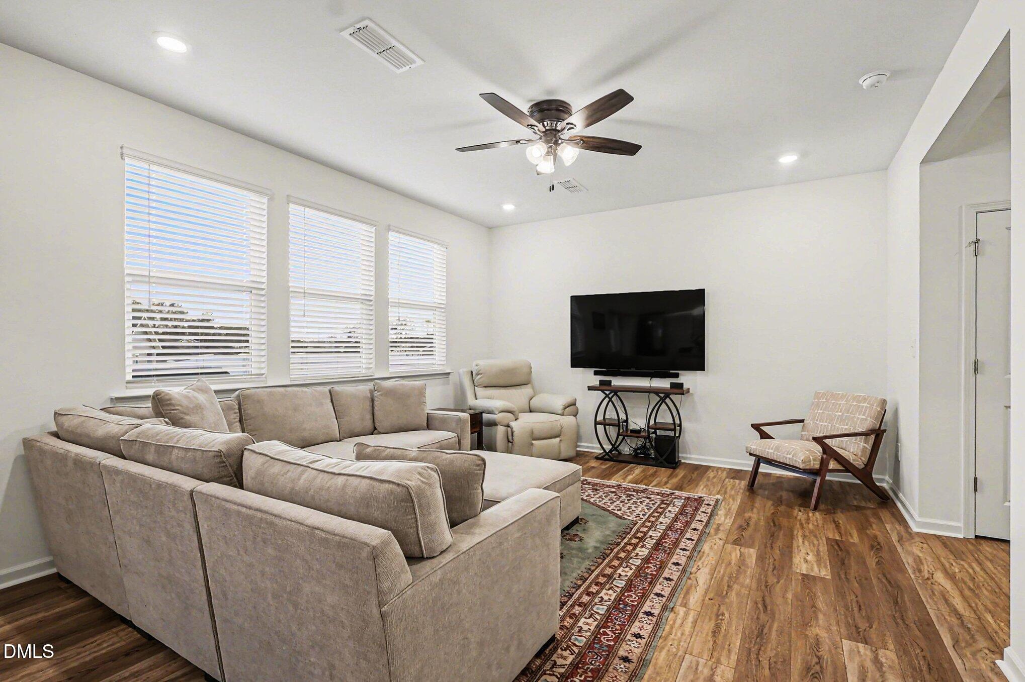 2732 Princess Tree Drive Raleigh, NC 27616 - Photo 3 of 32 a living room with furniture and a flat screen tv