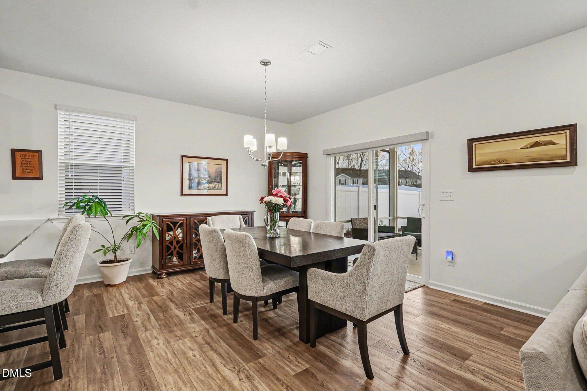 2732 Princess Tree Drive Raleigh, NC 27616 - Photo 4 of 32 a view of a dining room with furniture window and wooden floor