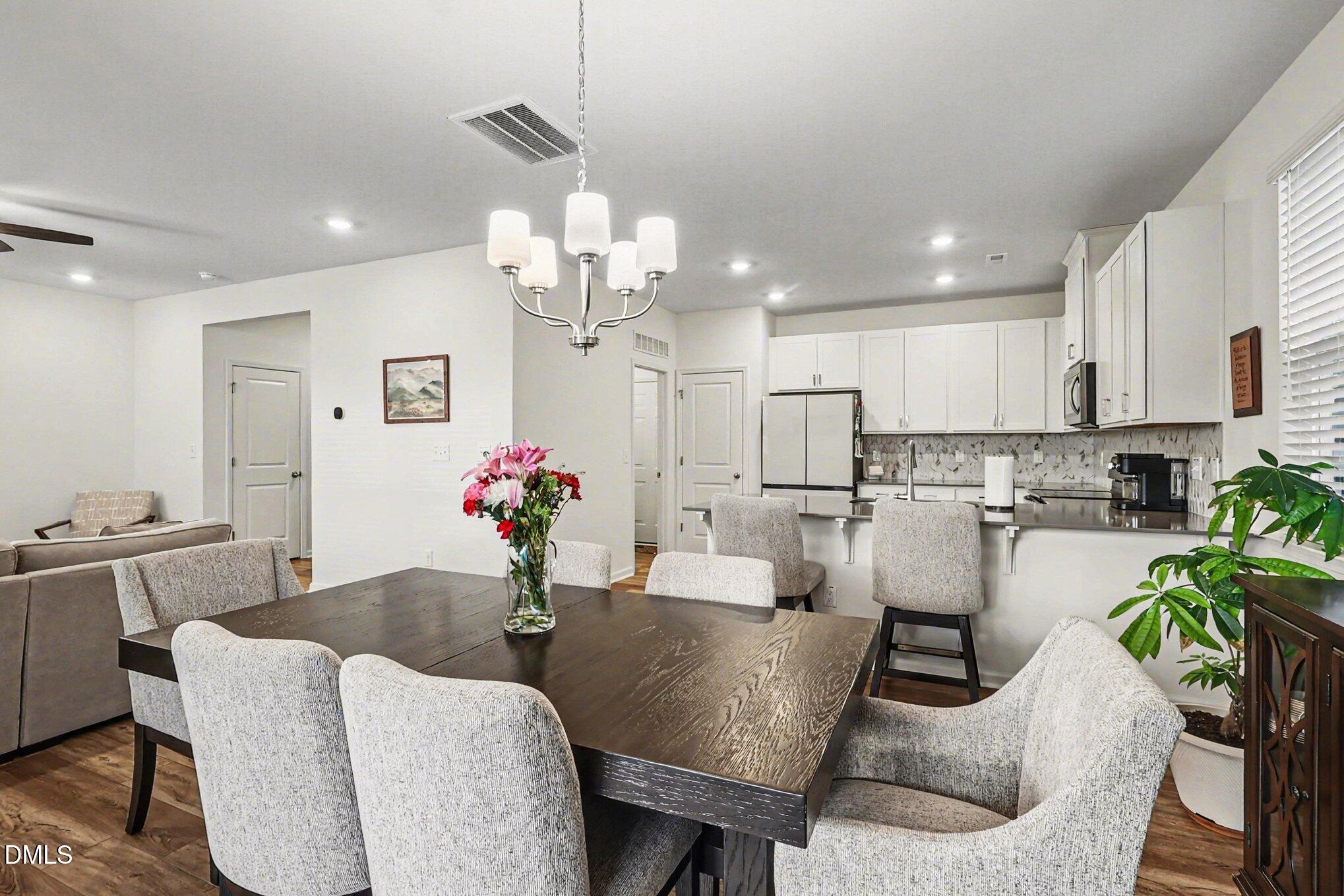 2732 Princess Tree Drive Raleigh, NC 27616 - Photo 5 of 32 a living room with furniture kitchen and a chandelier