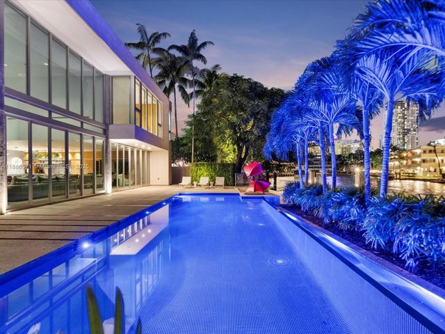 a view of a patio with swimming pool table and chairs