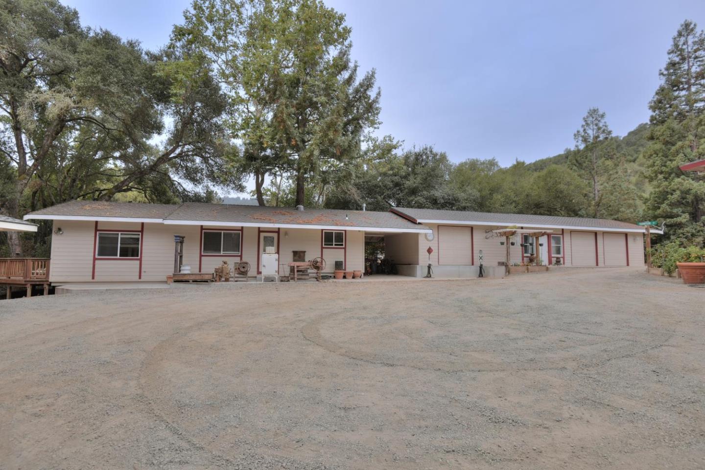 5300 Hecker Pass Road Gilroy, CA 95020 - Photo 36 of 46 a front view of a house with a yard and trees