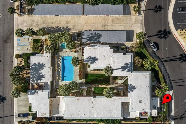 an aerial view of houses with outdoor space