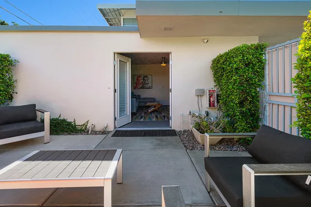 a view of backyard with seating space