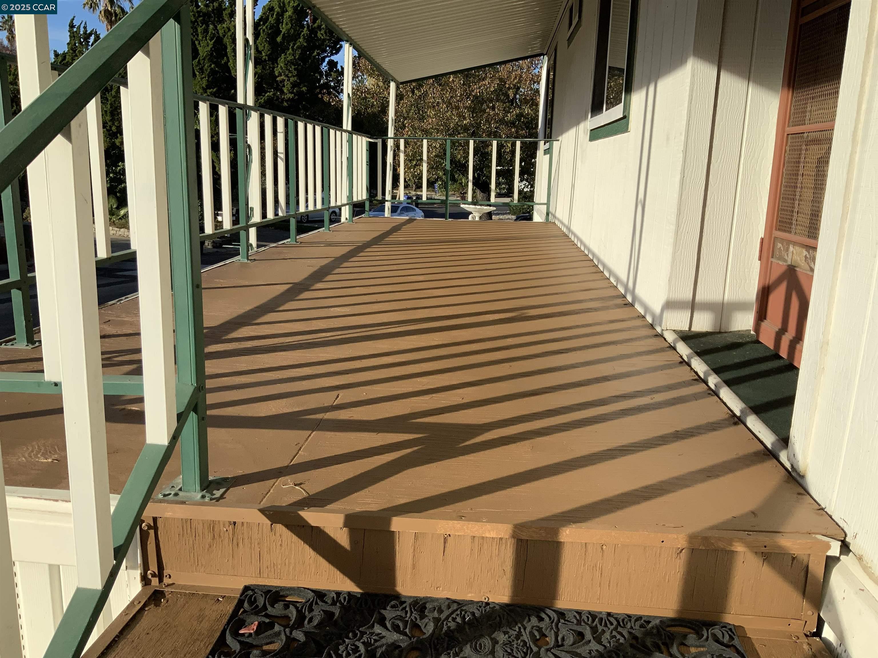 202 Queens Way Pittsburg, CA 94565 - Photo 15 of 29 a view of a balcony with wooden floor
