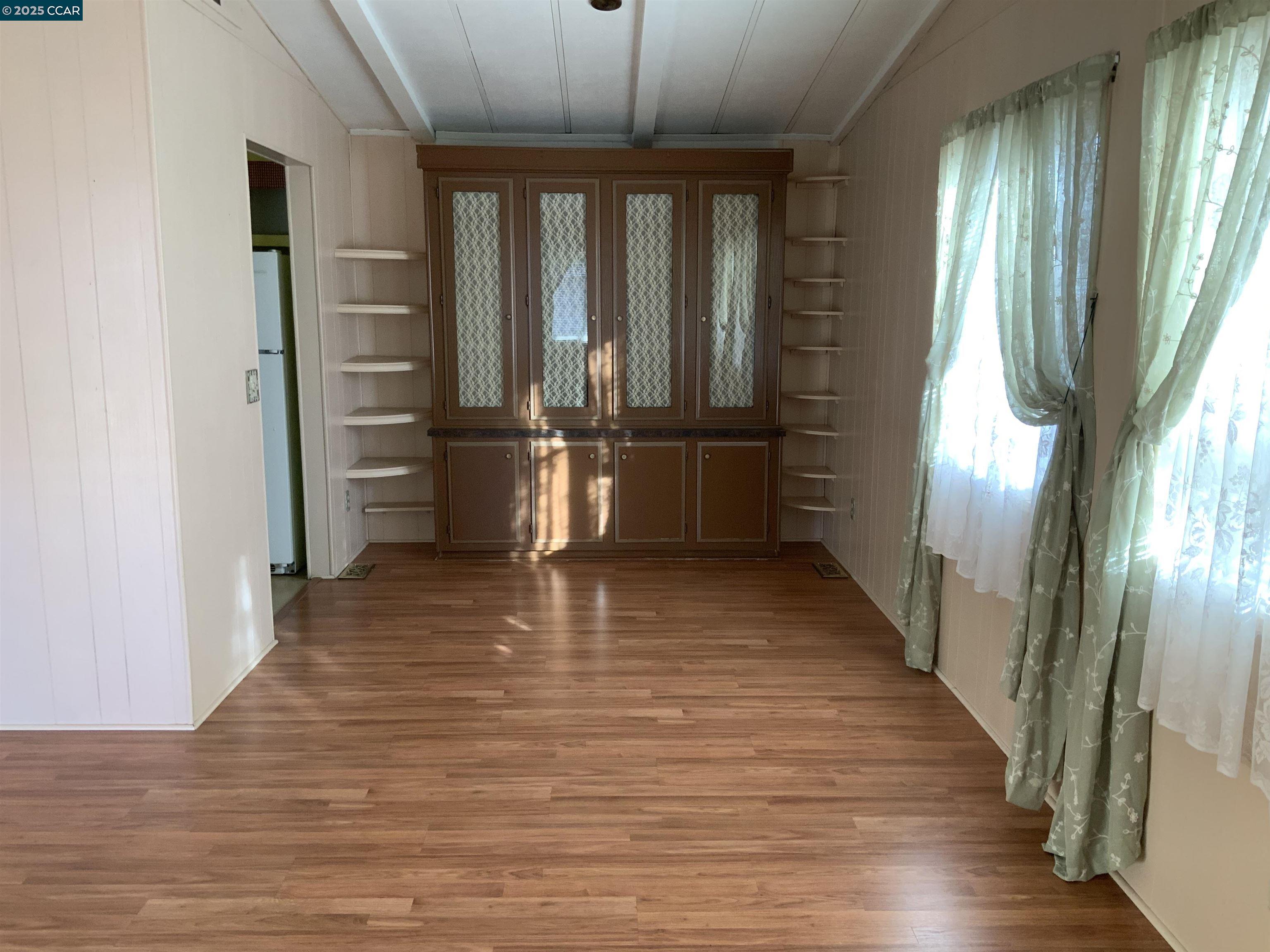202 Queens Way Pittsburg, CA 94565 - Photo 17 of 29 a view of a hallway view with wooden floor and staircase