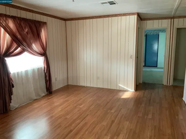 a kitchen with a sink a refrigerator and window