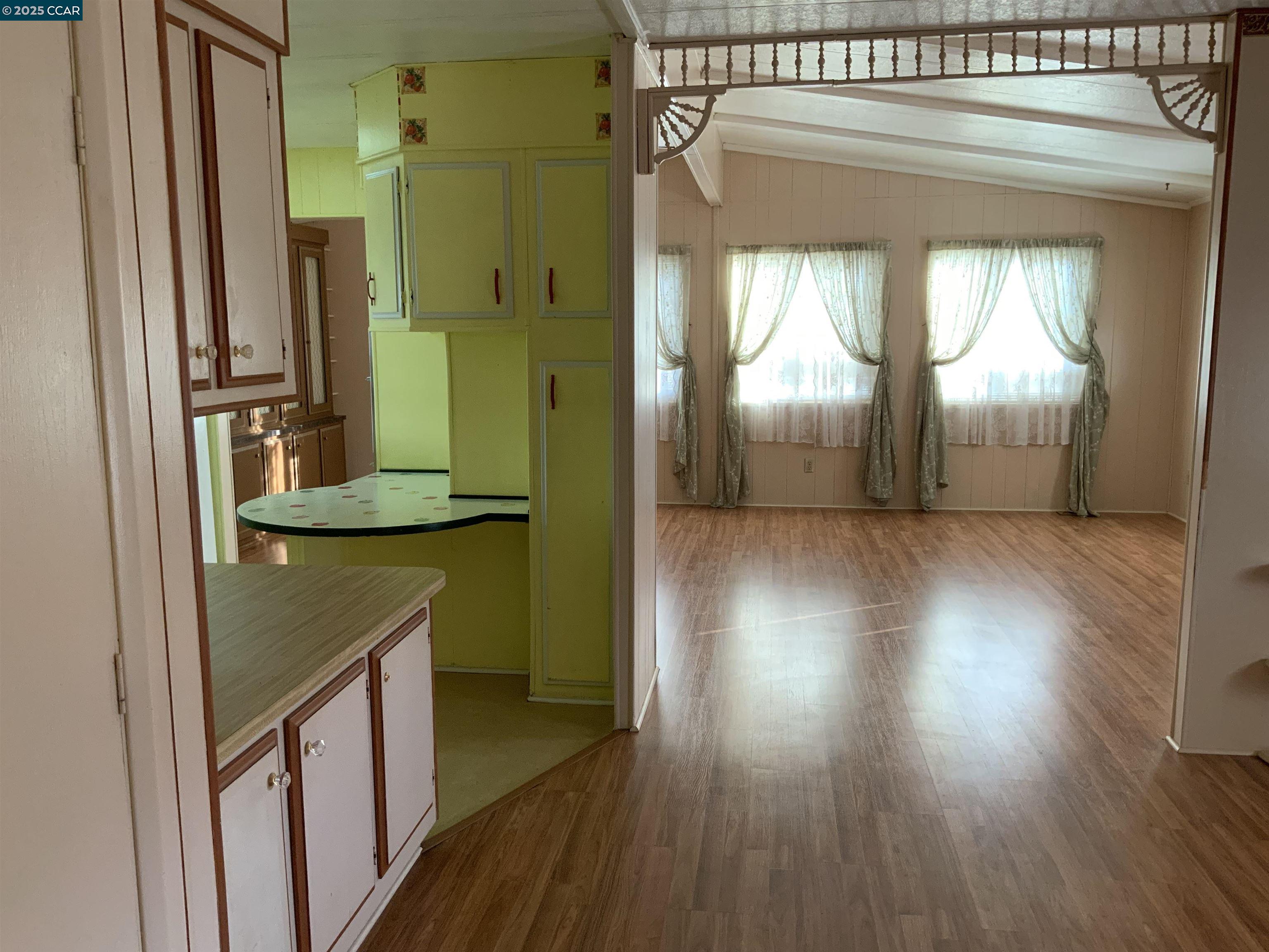 202 Queens Way Pittsburg, CA 94565 - Photo 20 of 29 a view of a hallway with wooden floor and stairs