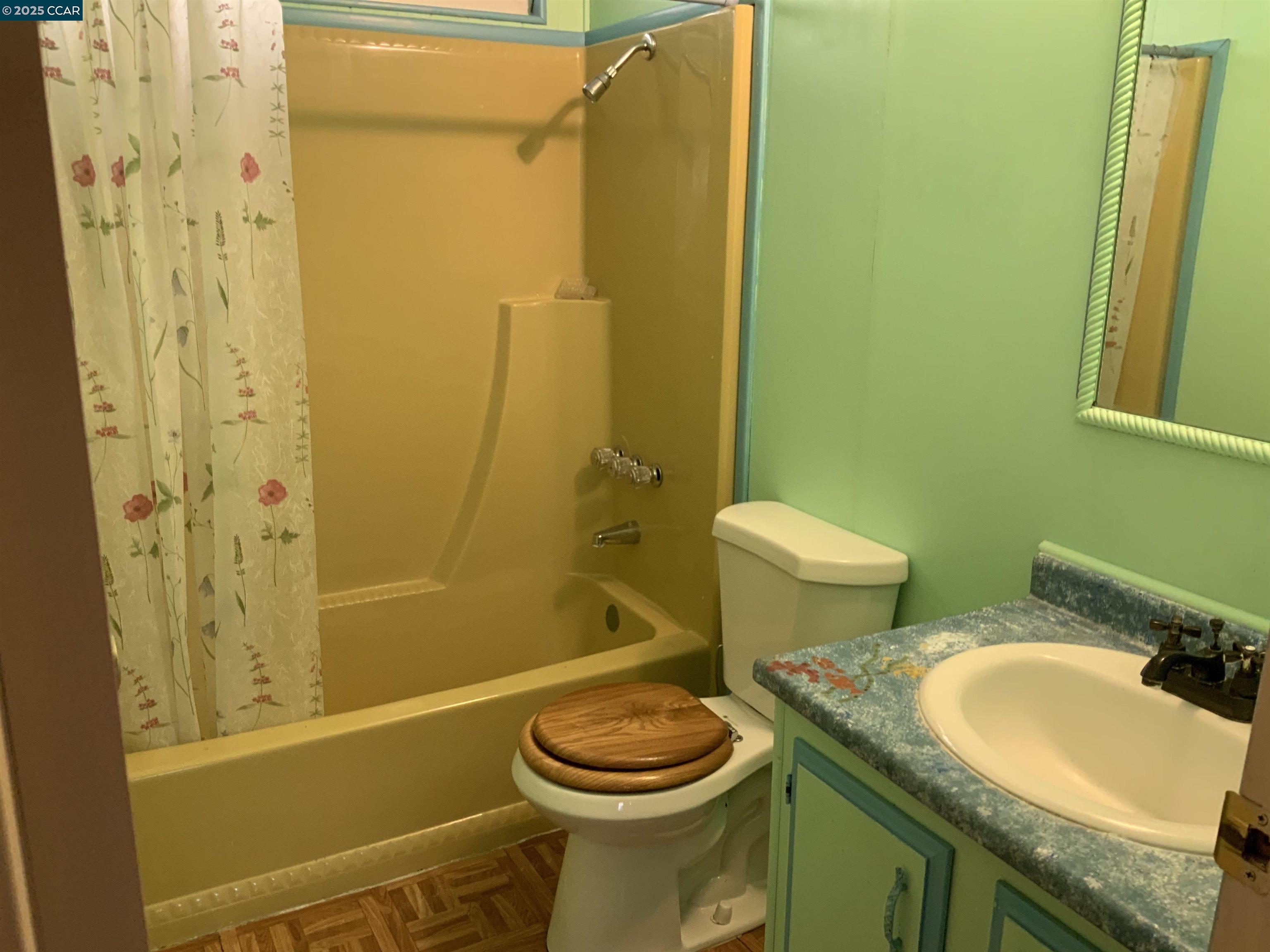 202 Queens Way Pittsburg, CA 94565 - Photo 3 of 29 a bathroom with a granite countertop toilet sink and shower