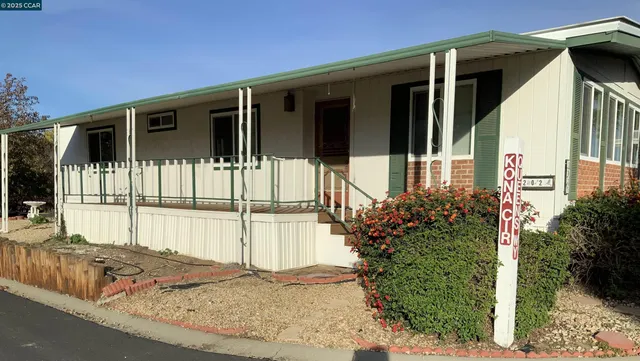 a front view of a house with a porch
