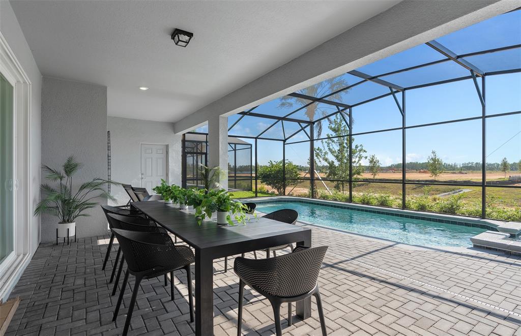 15918 Calm Key Loop Clermont, FL 34714 - Photo 19 of 57 a view of a dining room with furniture window and outside view